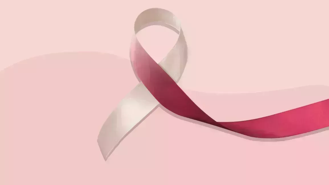 Crimson and white oral cancer awareness month ribbon