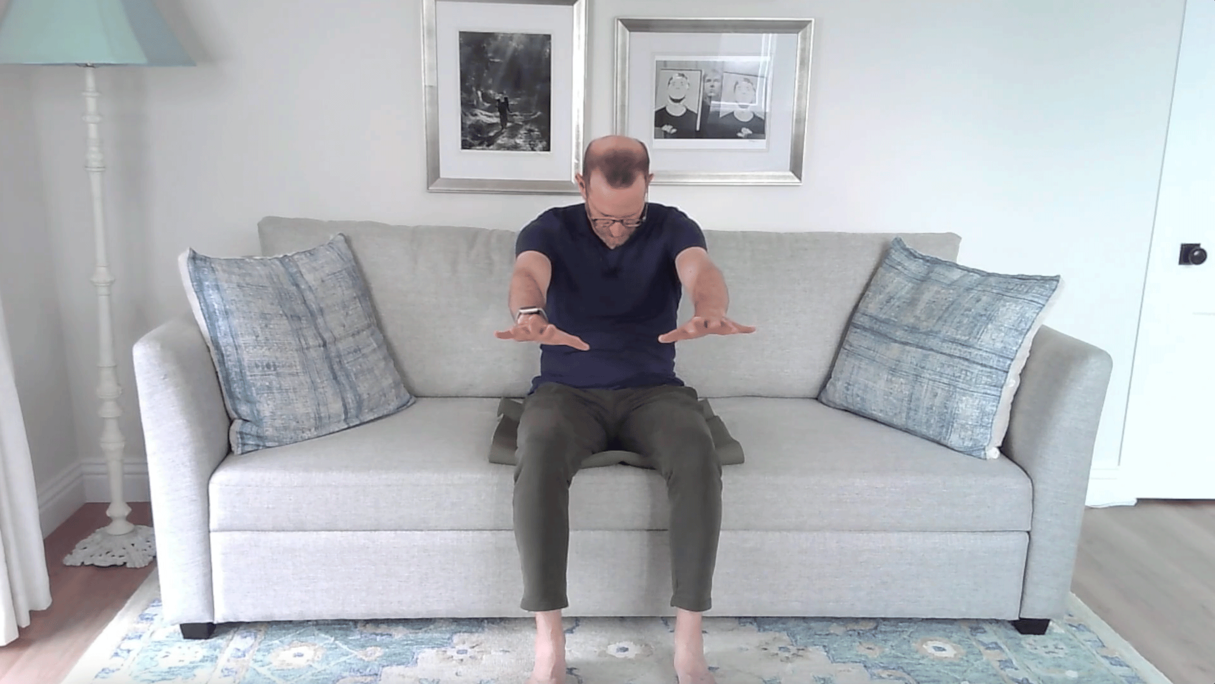 A Quick Couch Yoga Practice (Yes, Couch) for When You Want to Stay Sitting