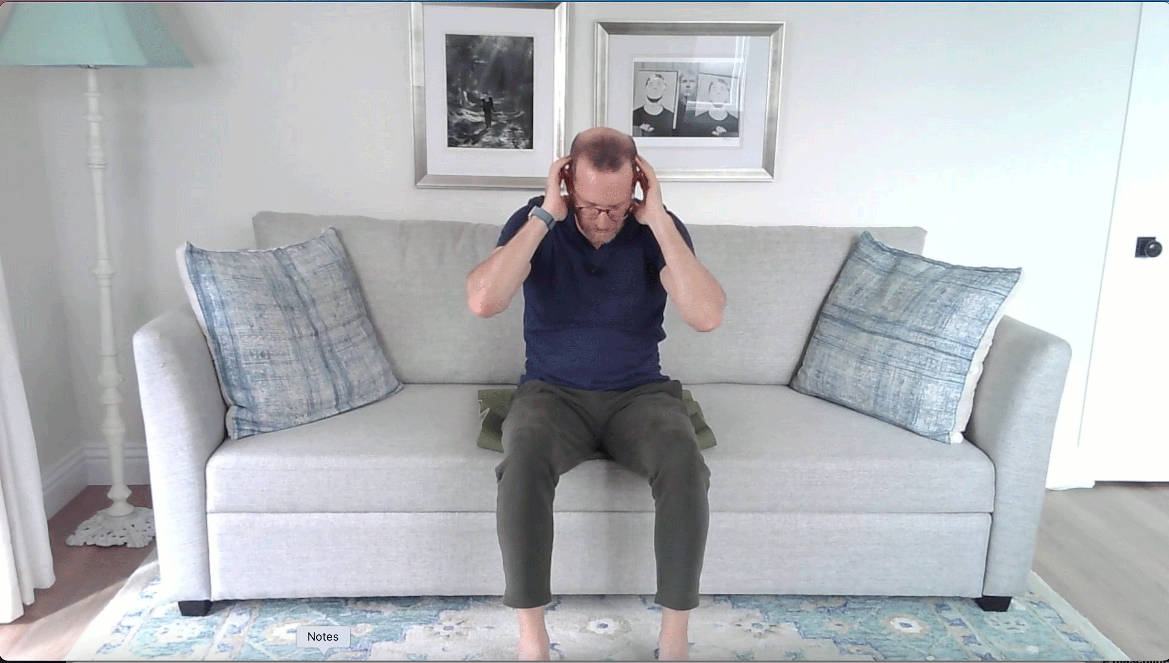 A Quick Couch Yoga Practice (Yes, Couch) for When You Want to Stay Sitting